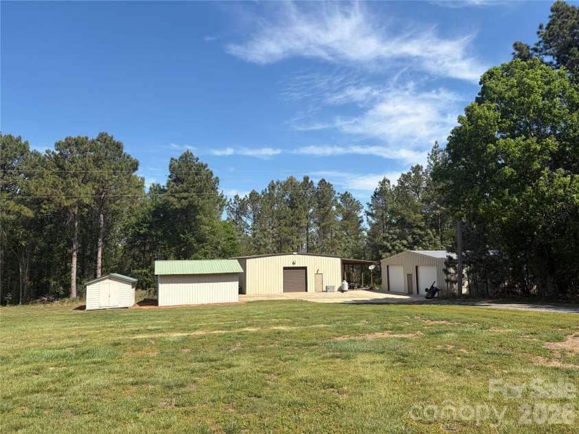 7812 Hwy 742 Highway, Marshville, NC 28103.  MLS# CAR4383299, YatesRealty ID 13761. Existing buildings perfect for car enthusiasts, storage, recreation, and more