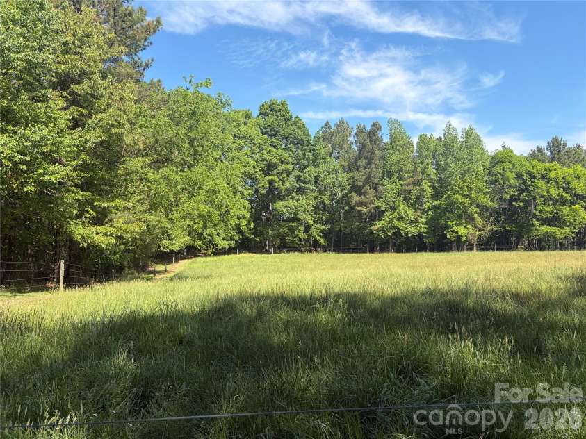 7812 Hwy 742 Highway, Marshville, NC 28103.  MLS# CAR4383299, YatesRealty ID 13761. Fenced pasture, ready for animals, homesteaders, and hobby farmers