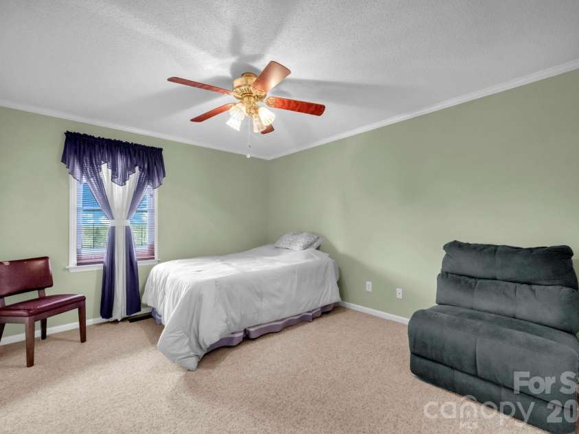 7812 Hwy 742 Highway, Marshville, NC 28103.  MLS# CAR4383299, YatesRealty ID 13761. Guest bedroom with large wall closet and ceiling fan