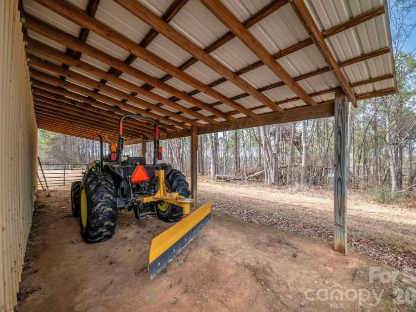 7812 Hwy 742 Highway, Marshville, NC 28103.  MLS# CAR4383299, YatesRealty ID 13761. Lean-to attached to barn for future animal use or tractor storage