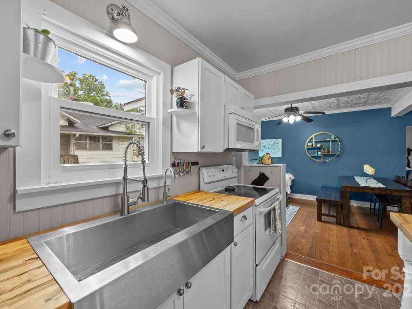 1001 Old Charlotte Road, Concord, NC 28027.  MLS# CAR4254324, YatesRealty ID 13764. Butcher block counter tops and stainless steel farmhouse sink