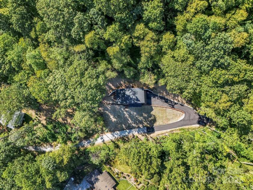 45 Jennifer Drive, Hendersonville, NC 28791.  MLS# CAR4298076, YatesRealty ID 13768. Aerial view looking down at the home, private and tucked away yet only 9 minutes to downtown!