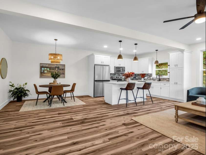 45 Jennifer Drive, Hendersonville, NC 28791.  MLS# CAR4298076, YatesRealty ID 13768. Looking from the front door into the open living room, dining area and kitchen