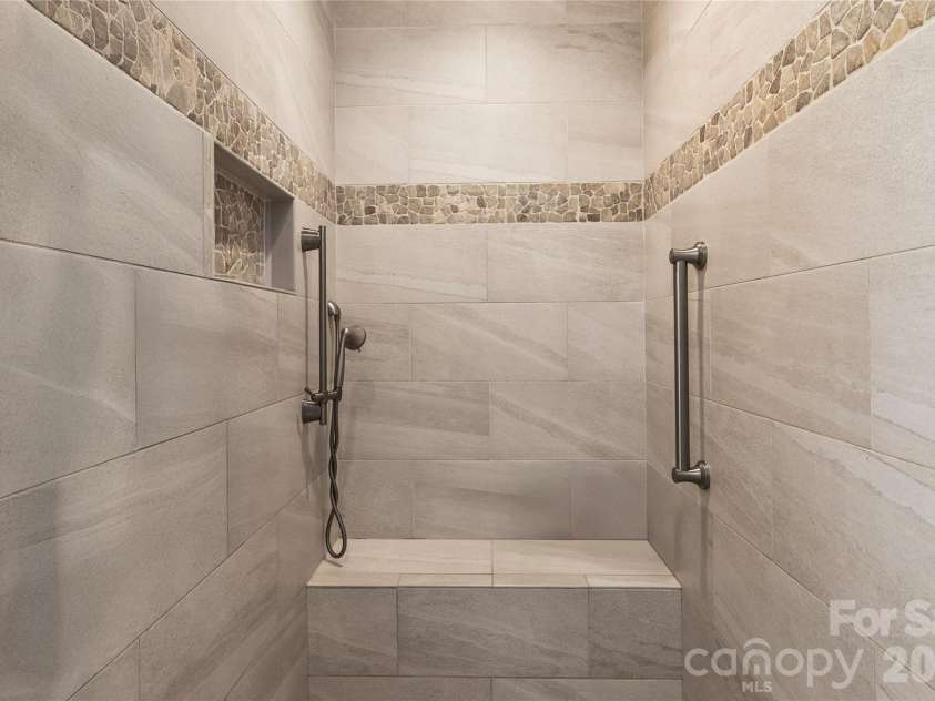 1103 River Ridge Way, Lenoir, NC 28645.  MLS# CAR4364618, YatesRealty ID 13770. Fully tiled walk in Primary Shower