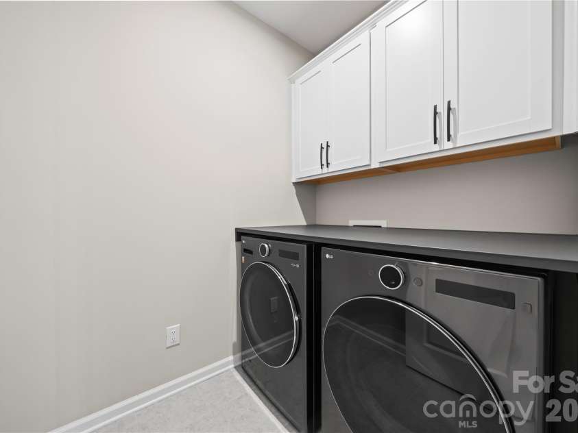 9838 Quercus Lane, Huntersville, NC 28078.  MLS# CAR4358813, YatesRealty ID 13787. Main level laundry room with custom folding shelf