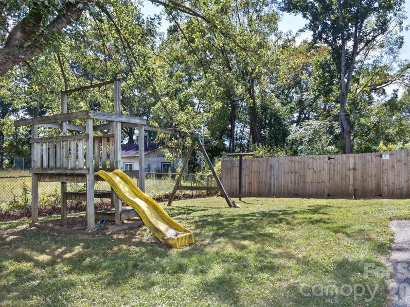 30 Valley Hill Drive, Canton, NC 28716.  MLS# CAR4364203, YatesRealty ID 13798. Swing set in side yard