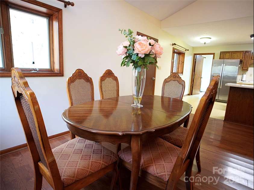28 Fore Road, Asheville, NC 28806.  MLS# CAR4206820, YatesRealty ID 13803. Dining area looking into kitchen. (Door to laundry and mud room)