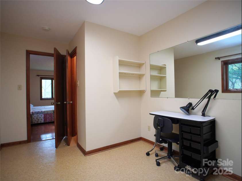 28 Fore Road, Asheville, NC 28806.  MLS# CAR4206820, YatesRealty ID 13803. Office area with 1/2 bath (entrance through primary and also through laundry)