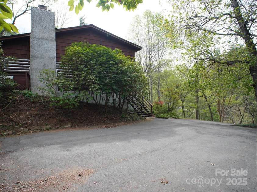 28 Fore Road, Asheville, NC 28806.  MLS# CAR4206820, YatesRealty ID 13803. Parking area and the side of the house
