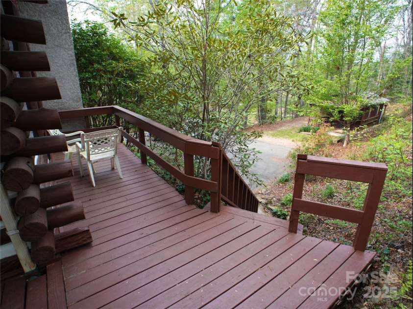 28 Fore Road, Asheville, NC 28806.  MLS# CAR4206820, YatesRealty ID 13803. Side of the house looking at the parking and workshop