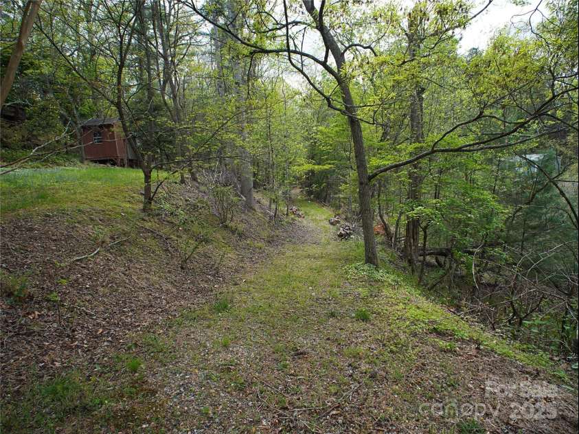 28 Fore Road, Asheville, NC 28806.  MLS# CAR4206820, YatesRealty ID 13803. Walking trail (pond on the right, house on the left)