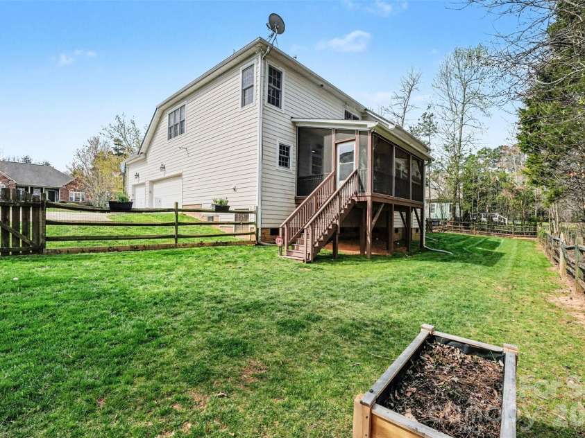 4111 Harmattan Drive, Denver, NC 28037.  MLS# CAR4358146, YatesRealty ID 13808. Ample sized backyard does extend into the woods, the fence is not the property line.