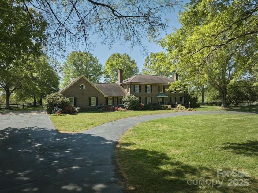 820 Phillips Road, Columbus, NC 28722.  MLS# CAR4250822, YatesRealty ID 13808. Brick home on 48ac estate