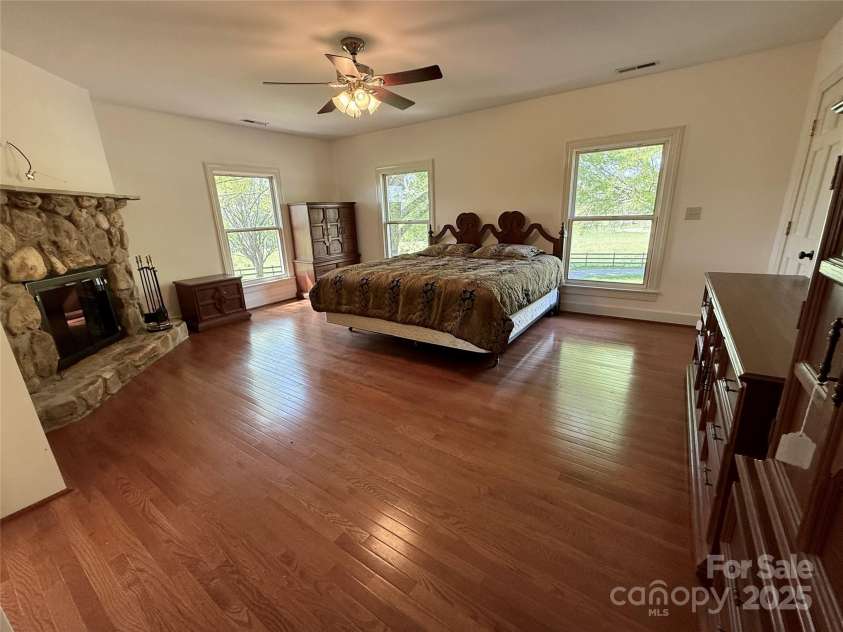 820 Phillips Road, Columbus, NC 28722.  MLS# CAR4250822, YatesRealty ID 13808. Primary bedroom with fireplace