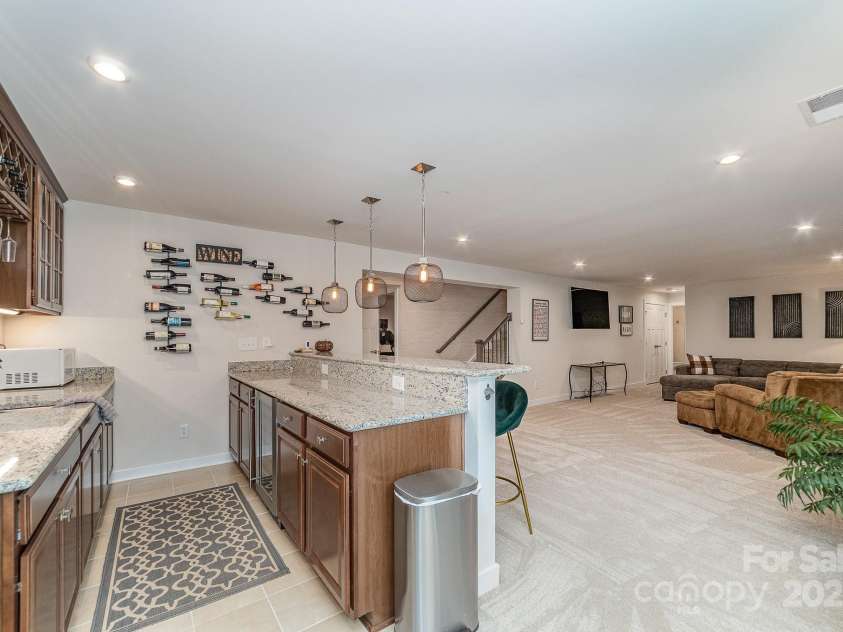 4660 Ardmore Lane, Harrisburg, NC 28075.  MLS# CAR4232846, YatesRealty ID 13811. Basement bar area