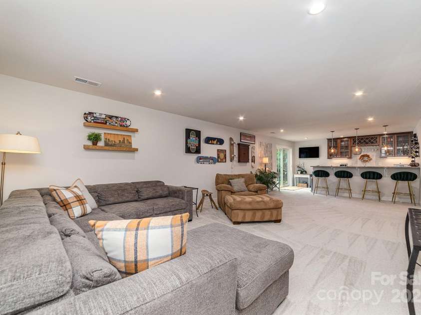 4660 Ardmore Lane, Harrisburg, NC 28075.  MLS# CAR4232846, YatesRealty ID 13811. Basement living room