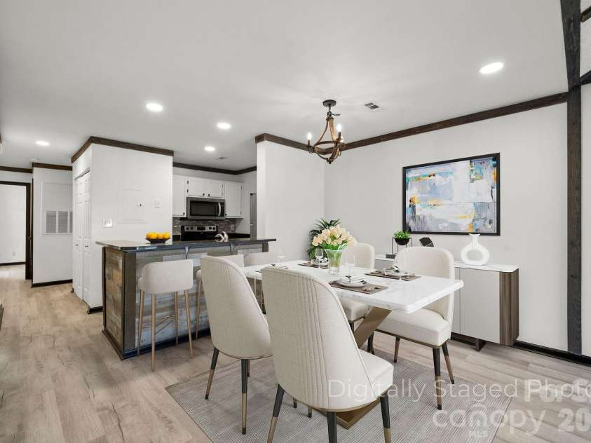 18755 Vineyard Point Lane, Cornelius, NC 28031.  MLS# CAR4371639, YatesRealty ID 13827. Digitally Staged Dining Area