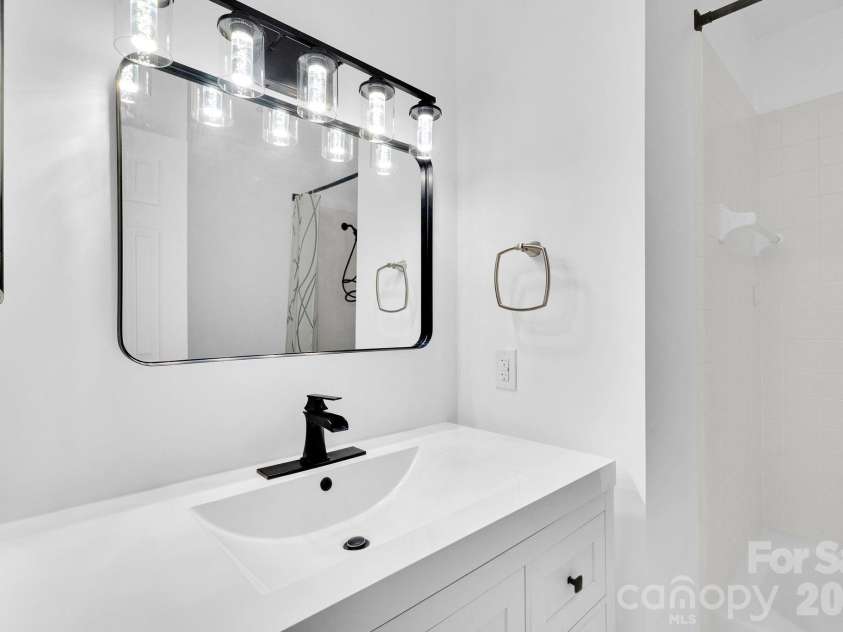 18755 Vineyard Point Lane, Cornelius, NC 28031.  MLS# CAR4371639, YatesRealty ID 13827. Hall Bathroom with New Vanity