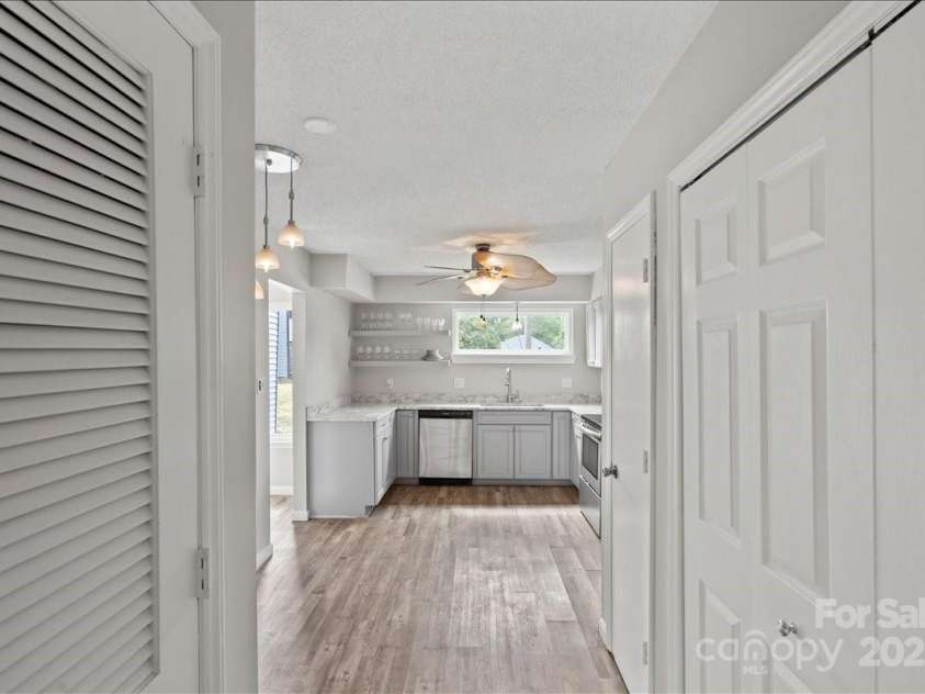 6610 Point Comfort Lane, Charlotte, NC 28226.  MLS# CAR4298567, YatesRealty ID 1383. Kitchen Hallway with Laundry Closet and Pantry