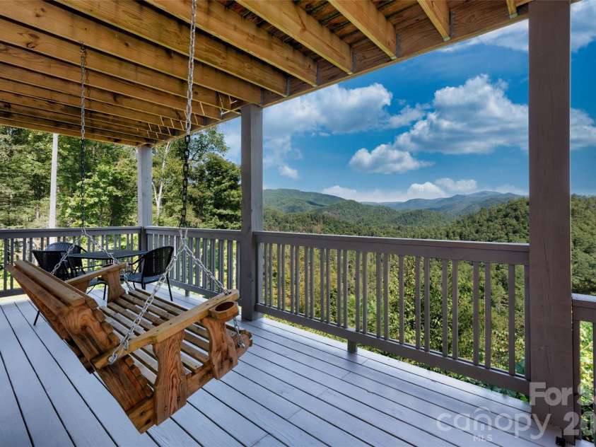 55 Laurel Ridge, Marshall, NC 28753.  MLS# CAR4353005, YatesRealty ID 13833. Porch swing facing sweeping long range 