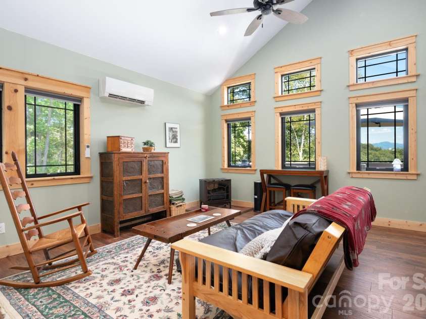 55 Laurel Ridge, Marshall, NC 28753.  MLS# CAR4353005, YatesRealty ID 13833. Several windows connecting you with the surrounding forest