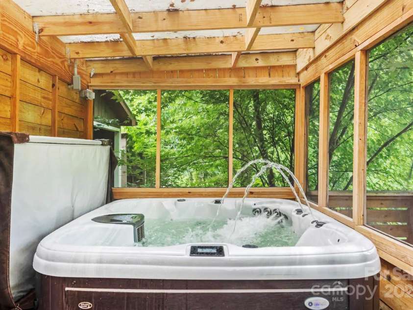 1236 Upper Brush Creek Road, Fairview, NC 28730.  MLS# CAR4233787, YatesRealty ID 13847. Cottage hot tub