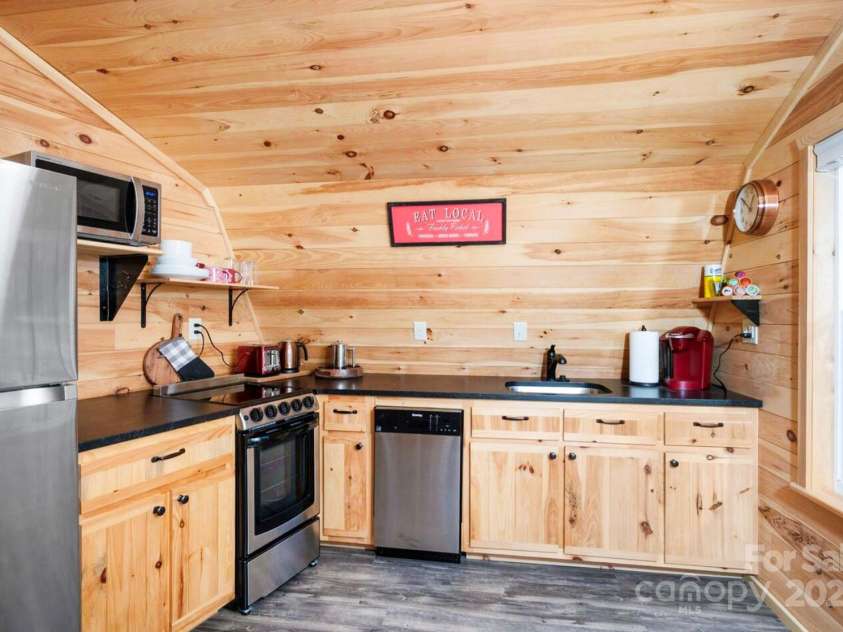 1236 Upper Brush Creek Road, Fairview, NC 28730.  MLS# CAR4233787, YatesRealty ID 13847. Guest house kitchen