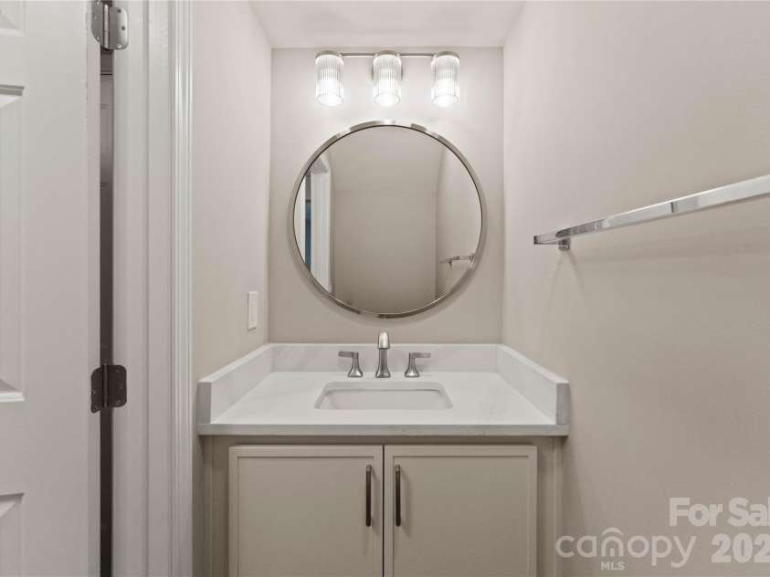 12819 Bullock Greenway Boulevard, Charlotte, NC 28277.  MLS# CAR4357908, YatesRealty ID 13849. Entry level half bath updated with new vanity, fixtures and lighting.