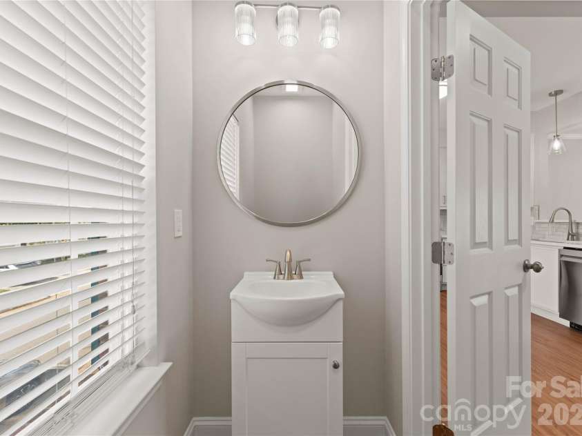 12819 Bullock Greenway Boulevard, Charlotte, NC 28277.  MLS# CAR4357908, YatesRealty ID 13849. Main level half bath off kitchen/breakfast area. 