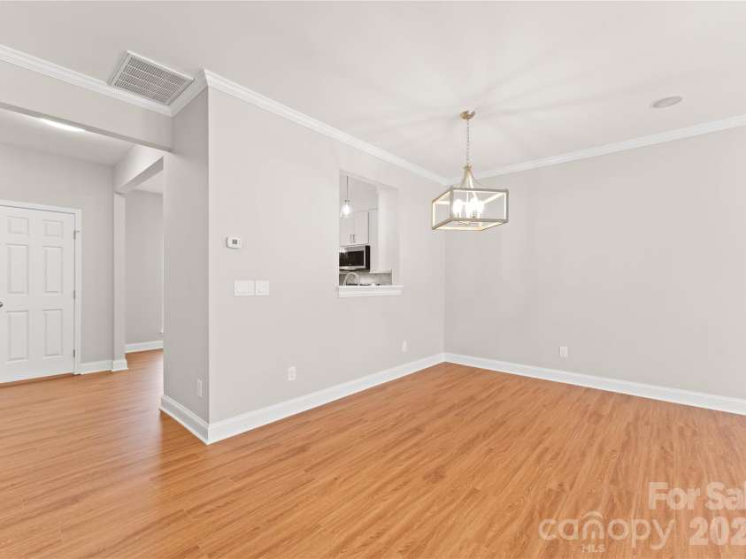 12819 Bullock Greenway Boulevard, Charlotte, NC 28277.  MLS# CAR4357908, YatesRealty ID 13849. Pass through from dining area to kitchen. 