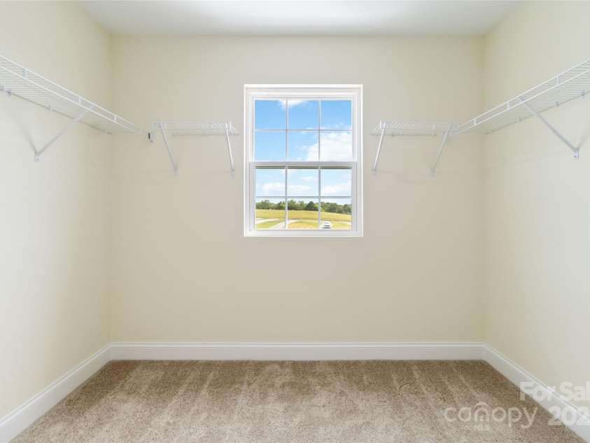 1034 Heath Helms Road, Monroe, NC 28110.  MLS# CAR4310413, YatesRealty ID 1386. Walk in closet (Primary Bedroom) 