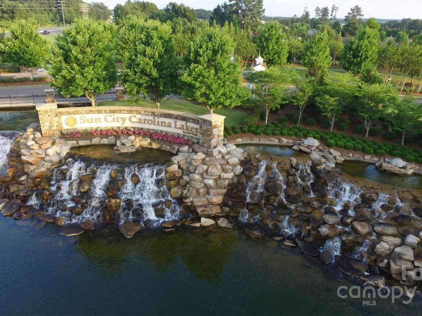 10432 Bethpage Drive, Indian Land, SC 29707.  MLS# CAR4235926, YatesRealty ID 13863. The majestic entrance to Sun City Carolina Lakes welcomes residents and guests to this premier active adult community. Come live the dream!