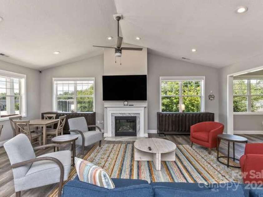 43 Sunny Meadows Boulevard, Arden, NC 28704.  MLS# CAR4249909, YatesRealty ID 13867. Fire place, TV and gathering area in the club house