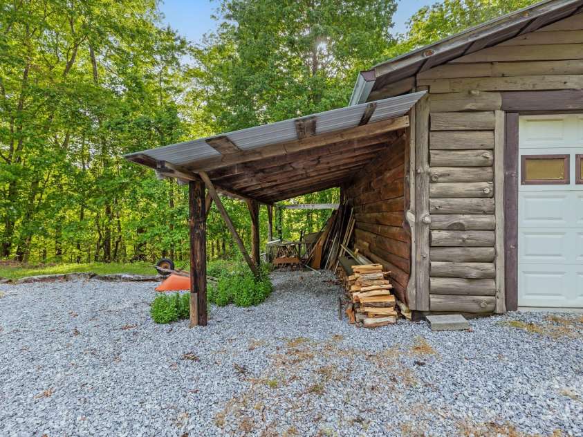 214 Hubert Mccall Road, Balsam Grove, NC 28708.  MLS# CAR4256871, YatesRealty ID 13872. Detached Two-Car Garage w/Covered Tractor Shed