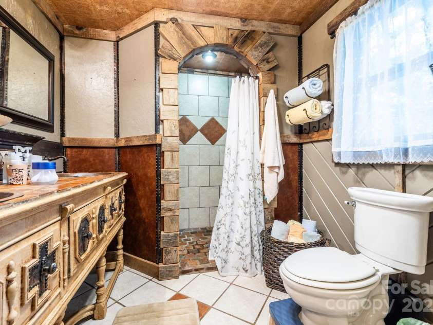 214 Hubert Mccall Road, Balsam Grove, NC 28708.  MLS# CAR4256871, YatesRealty ID 13872. Main Level Full Bathroom