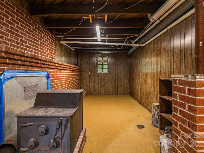 8171 Sugar Hill Road, Marion, NC 28752.  MLS# CAR4296295, YatesRealty ID 1388. Basement