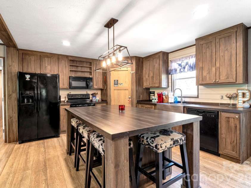 87 Horseback Lane, Marshall, NC 28753.  MLS# CAR4363036, YatesRealty ID 13882. Kitchen centerpiece: oversized island perfect for gatherings and meal prep