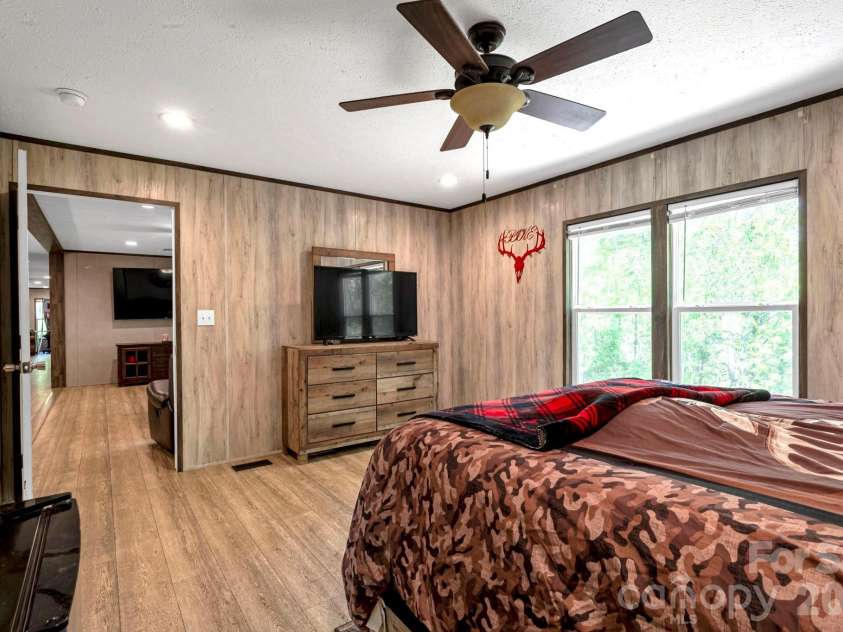 87 Horseback Lane, Marshall, NC 28753.  MLS# CAR4363036, YatesRealty ID 13882. Relaxing primary bedroom retreat