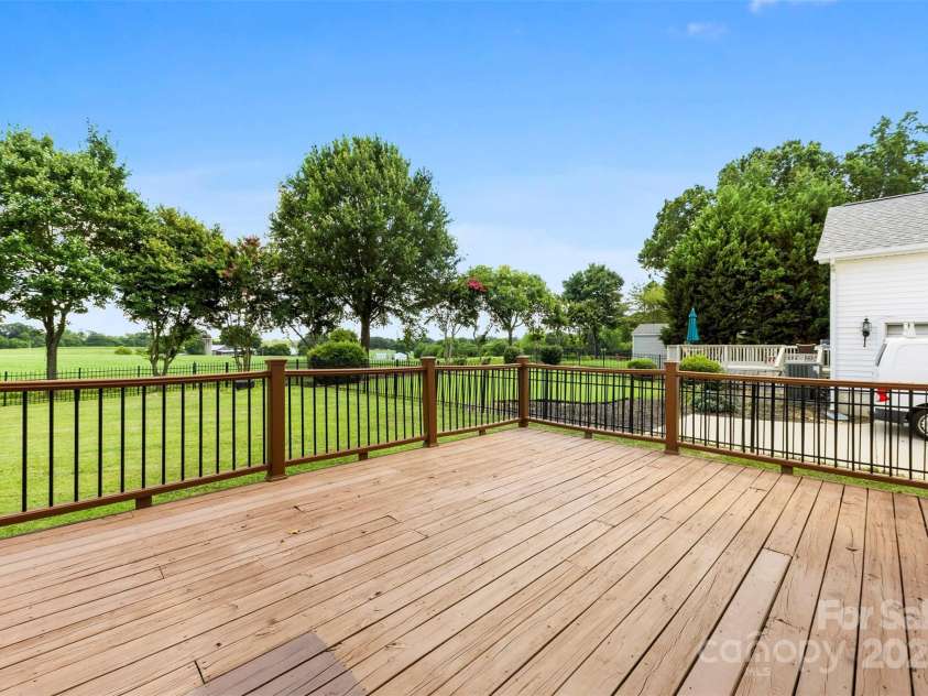 8806 Cool Meadow Drive, Huntersville, NC 28078.  MLS# CAR4232854, YatesRealty ID 13886. Back deck overlooking private farm.