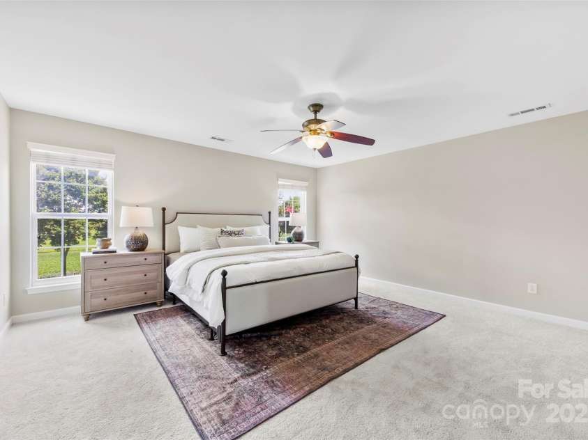 8806 Cool Meadow Drive, Huntersville, NC 28078.  MLS# CAR4232854, YatesRealty ID 13886. Spacious primary bedroom with ensuite bathroom.