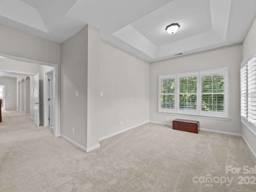 263 Fernbrook Drive, Mooresville, NC 28117.  MLS# CAR4246852, YatesRealty ID 13887. Spacious primary suite with double doors offers privacy on the second level.