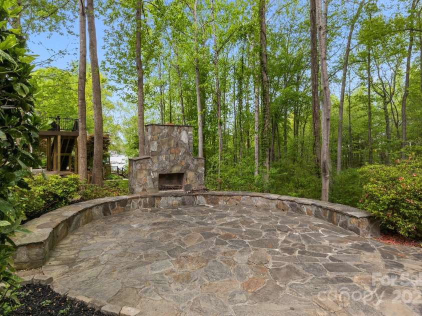 263 Fernbrook Drive, Mooresville, NC 28117.  MLS# CAR4246852, YatesRealty ID 13887. West Lake Facing Stone Fireplace and Patio