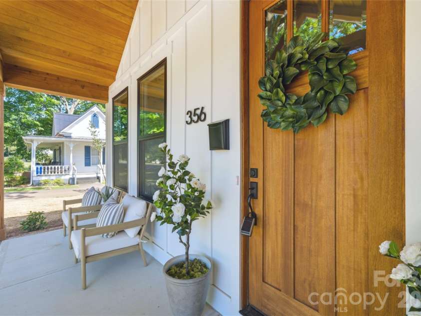 356 Main Street, McAdenville, NC 28101.  MLS# CAR4315707, YatesRealty ID 1389. A fresh take on modern farmhouse design with warm natural textures, clean architectural lines, and inviting front porch living