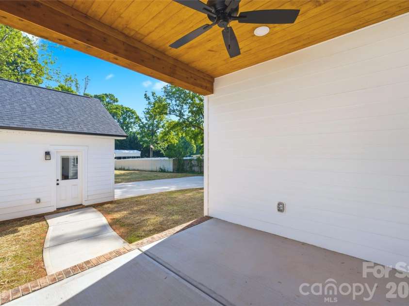 356 Main Street, McAdenville, NC 28101.  MLS# CAR4315707, YatesRealty ID 1389. An inviting back porch designed for morning coffee, quiet evenings, and everyday living