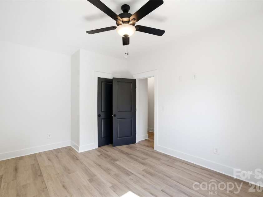 356 Main Street, McAdenville, NC 28101.  MLS# CAR4315707, YatesRealty ID 1389. Bedroom 2 with built-in niche adds character and functionality, creating the perfect spot for a workspace or entertainment area