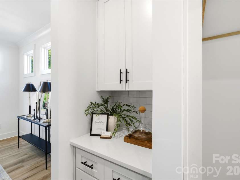 356 Main Street, McAdenville, NC 28101.  MLS# CAR4315707, YatesRealty ID 1389. Butler’s pantry with upper and lower cabinetry, ideal for entertaining, prep space, and hidden storage