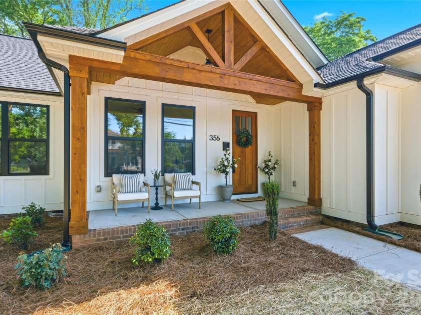 356 Main Street, McAdenville, NC 28101.  MLS# CAR4315707, YatesRealty ID 1389. Clean lines, warm woodwork, and modern farmhouse character in the heart of McAdenville — featuring custom craftsmanship and a stunning 8-foot mahogany door that creates a memorable first impression from the moment you arr