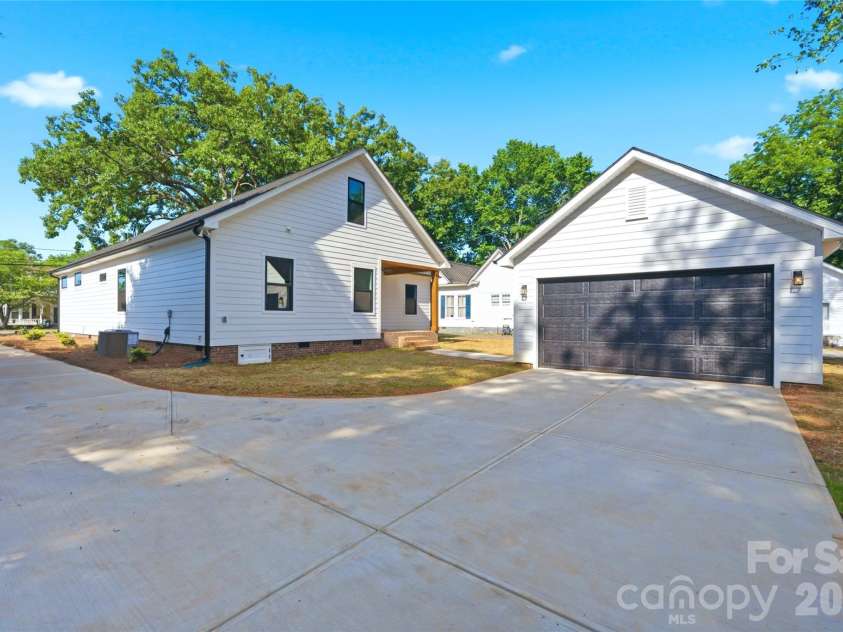 356 Main Street, McAdenville, NC 28101.  MLS# CAR4315707, YatesRealty ID 1389. Enjoy seamless flow from the detached garage to the covered back porch, complete with a functional drop zone to help keep clutter tucked away