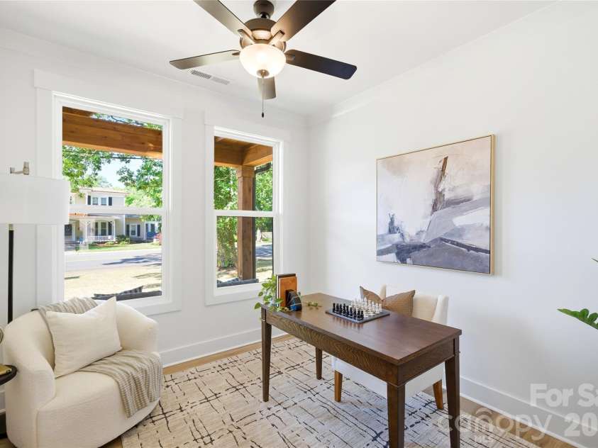 356 Main Street, McAdenville, NC 28101.  MLS# CAR4315707, YatesRealty ID 1389. Light-filled and versatile, the dedicated home office with double doors offers the perfect space for remote work, creative projects, or a quiet retreat — all framed by oversized windows overlooking the charming streetscap