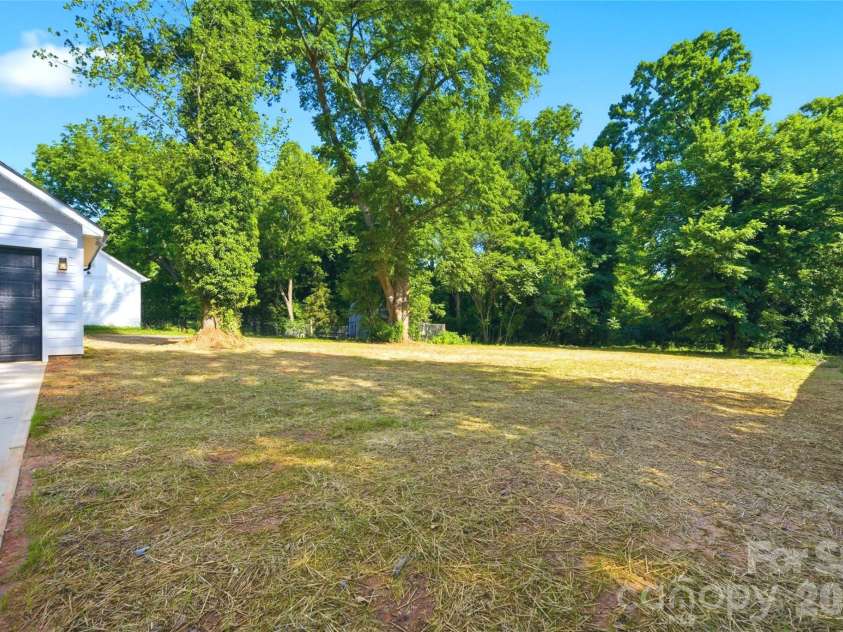 356 Main Street, McAdenville, NC 28101.  MLS# CAR4315707, YatesRealty ID 1389. The expansive, level backyard creates the perfect setting for cookouts, gatherings, and everyday enjoyment